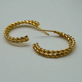 twisted golden hoops