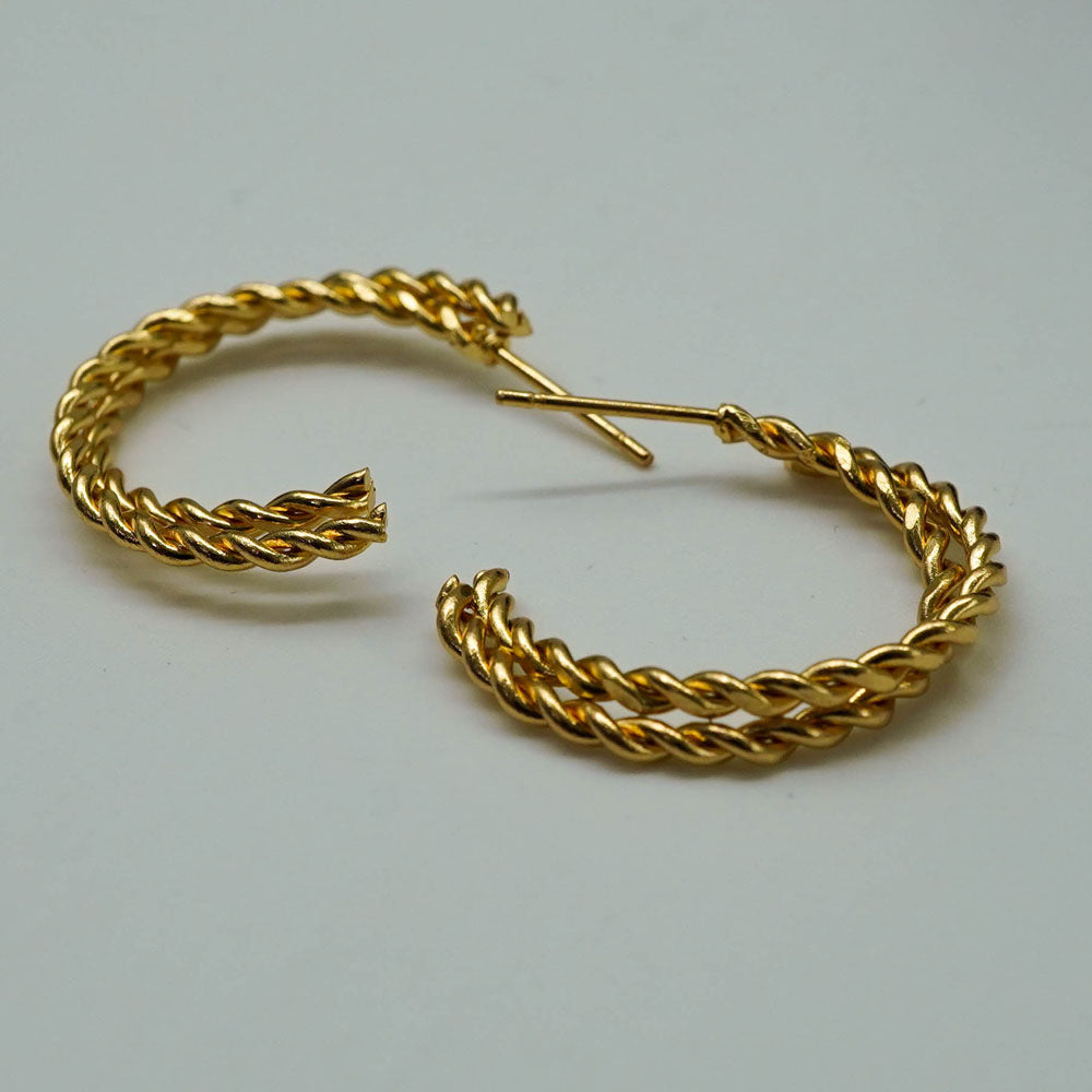 twisted golden hoops