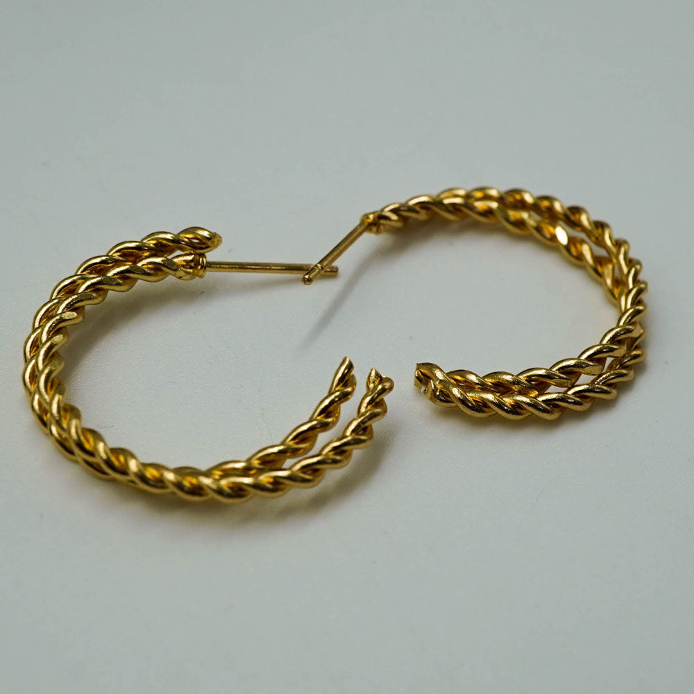 twisted golden hoops
