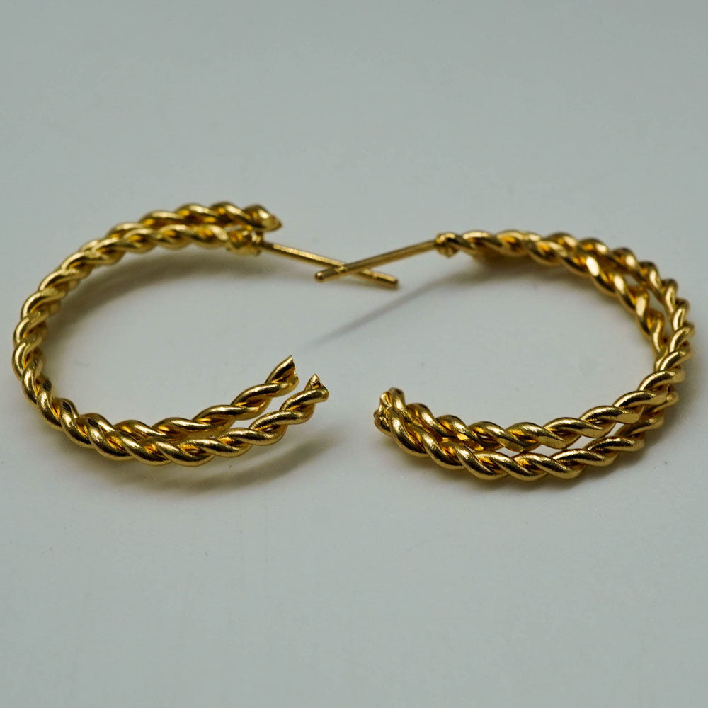 twisted golden hoops