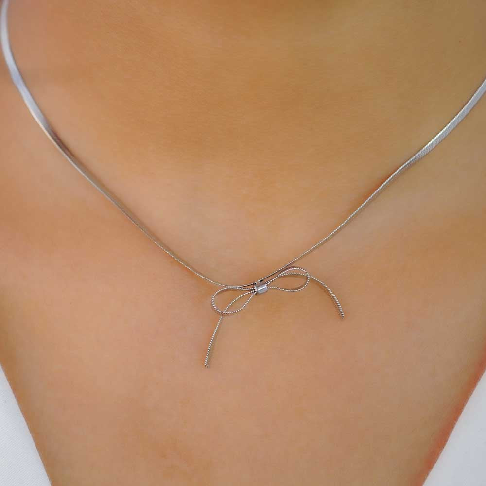 Thin Silver bow pendant