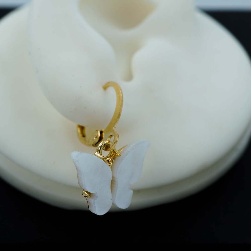 white butterfly drops