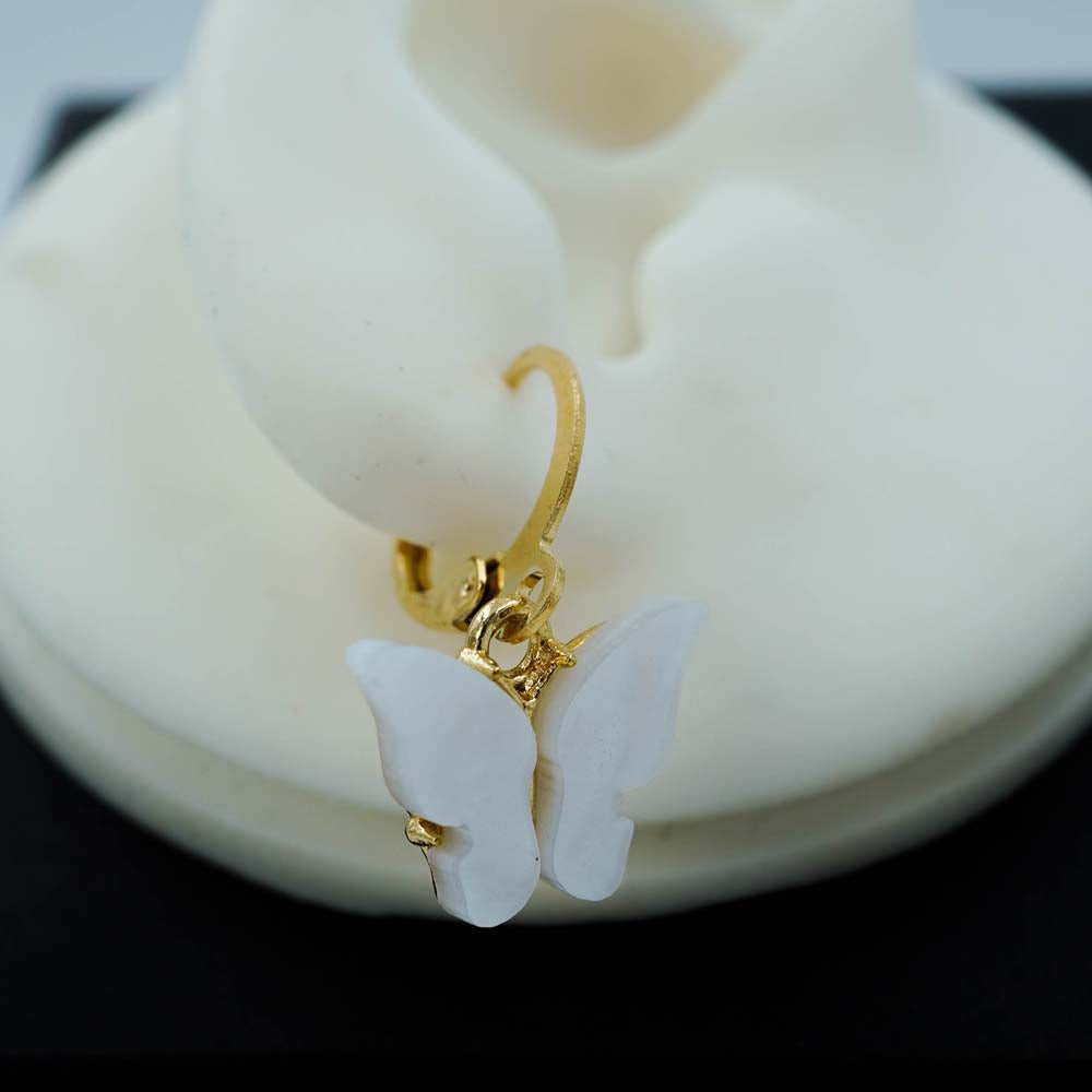 white butterfly drops
