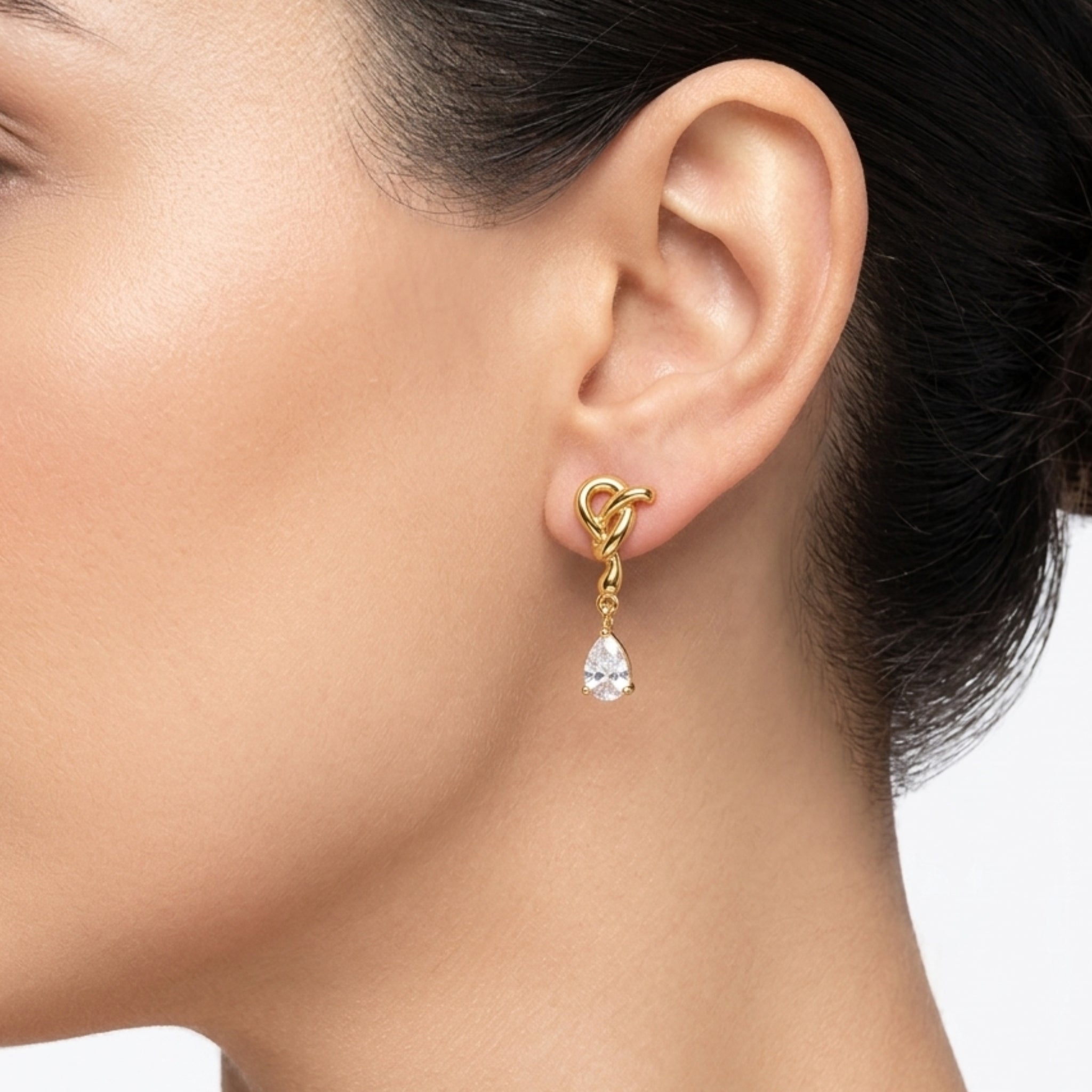 Gold-Tone Love Knot Drop Earrings with Pear-Cut Stone