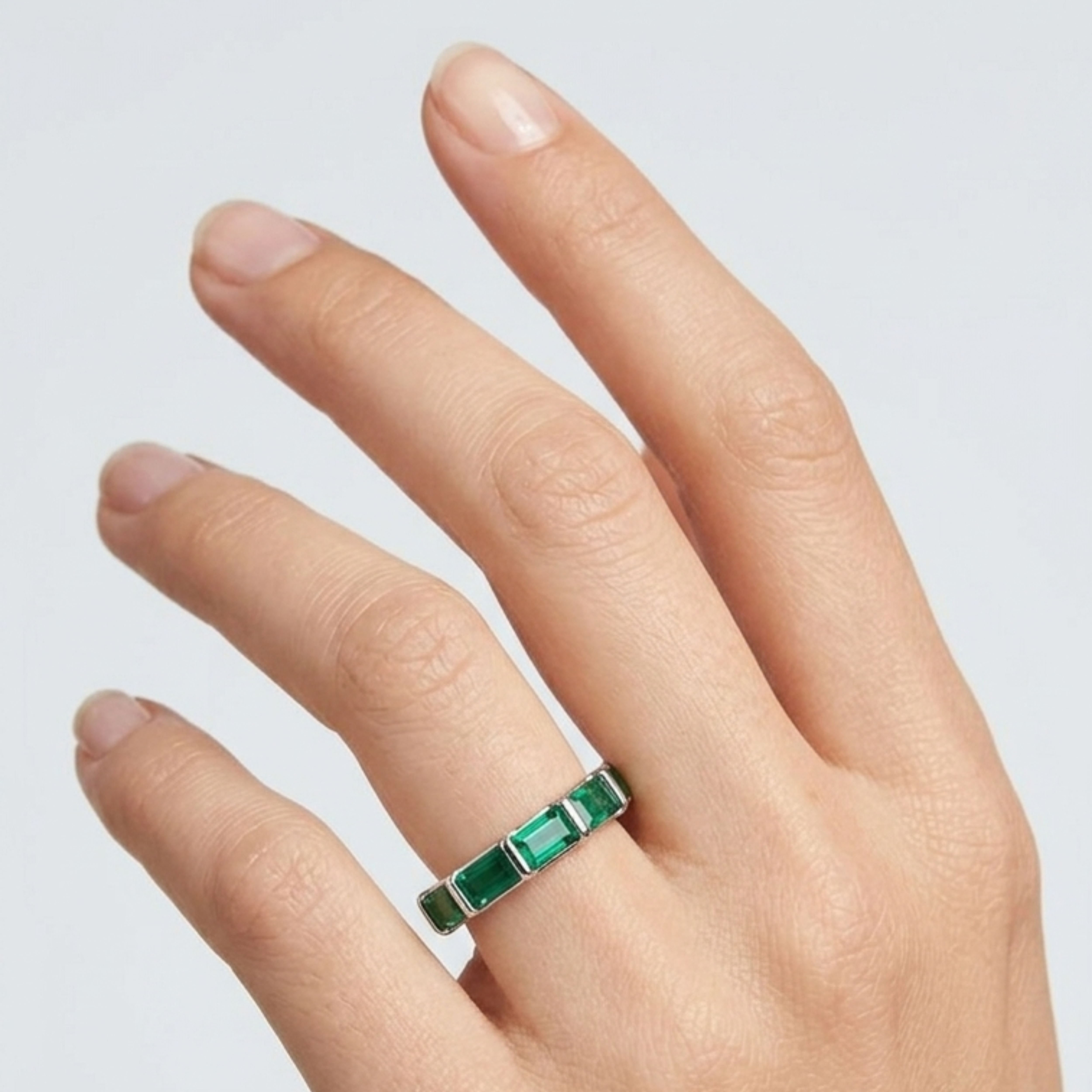 Emerald Cut Green Crystal Eternity Band in Sterling Silver Finish