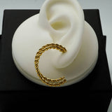 twisted golden hoops